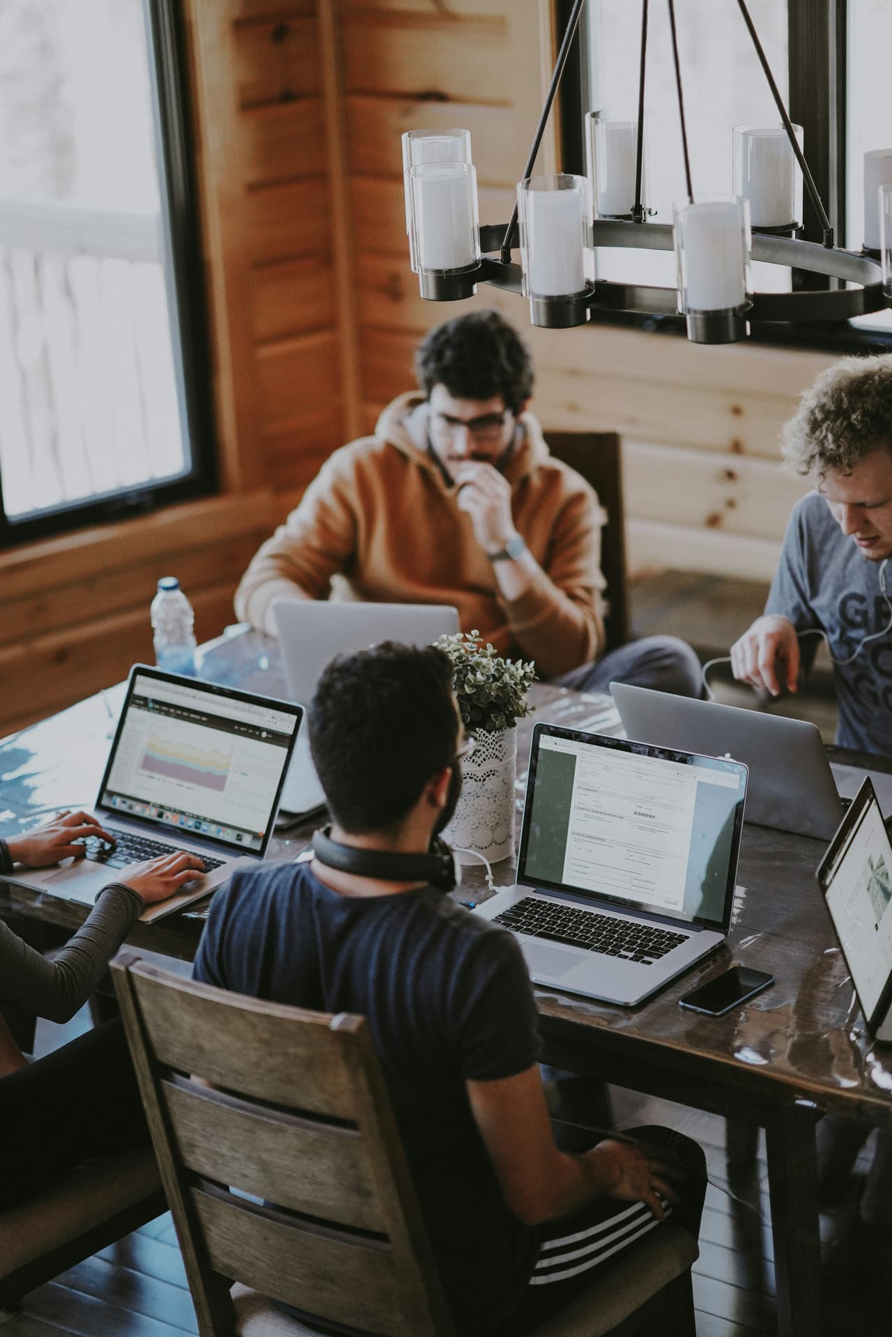 Team building bespoke surveys on laptops
